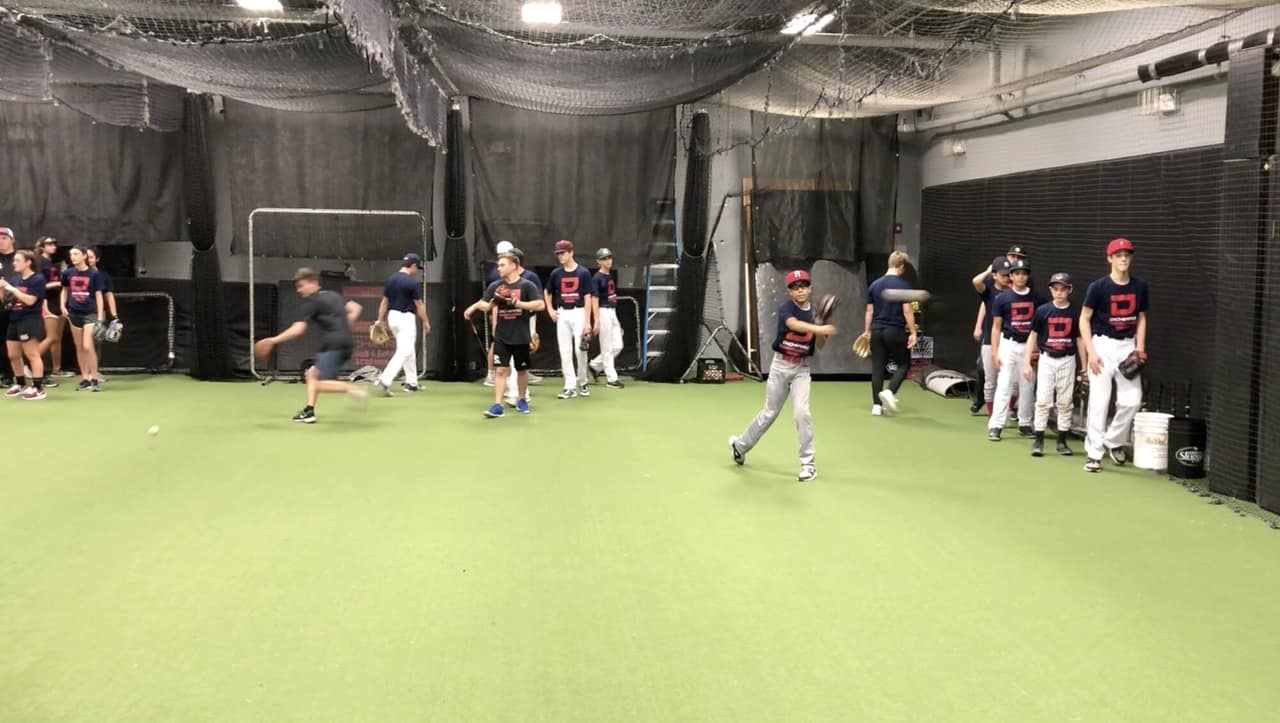 The full academy floor with the batting nets up